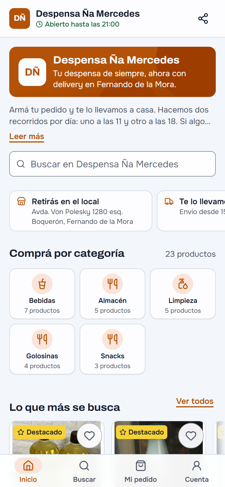 La tienda online de Despensa Ña Mercedes en el celular: «Abierto hasta las 21:00», la portada «Tu despensa de siempre, ahora con delivery en Fernando de la Mora», el texto de los dos recorridos por día, el buscador, «Retirás en el local» y «Te lo llevamos», «Comprá por categoría» con Bebidas, Almacén, Limpieza, Golosinas y Snacks, y «Lo que más se busca»; abajo Inicio, Buscar, Mi pedido y Cuenta